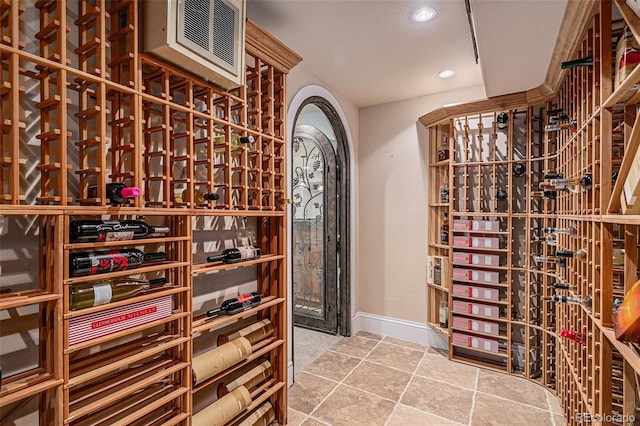 wine area featuring recessed lighting and baseboards