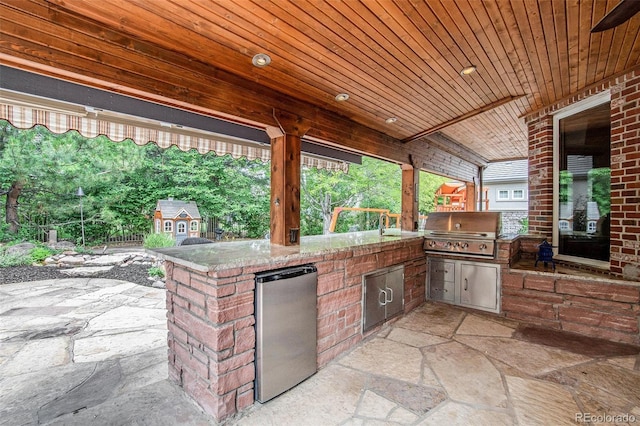 view of patio / terrace featuring area for grilling and an outdoor kitchen