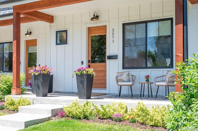 2571 S Cherokee St, Denver, CO 80223 - view of exterior entry featuring board and batten siding and covered porch