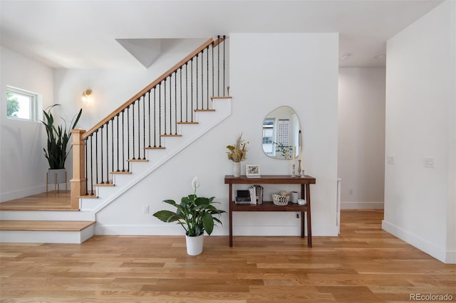 2571 S Cherokee St, Denver, CO 80223 - staircase featuring wood finished floors and baseboards