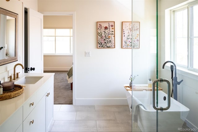 2571 S Cherokee St, Denver, CO 80223 - bathroom featuring vanity and a freestanding tub