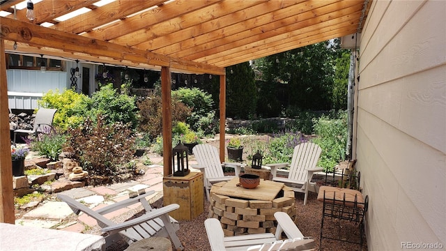 5298 Pony Creek Cir, Colorado Springs, CO 80919 - view of patio / terrace with a pergola and an outdoor fire pit