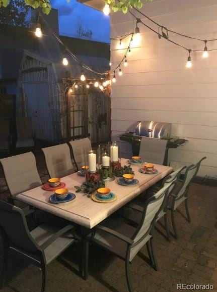 5298 Pony Creek Cir, Colorado Springs, CO 80919 - patio at twilight featuring outdoor dining space