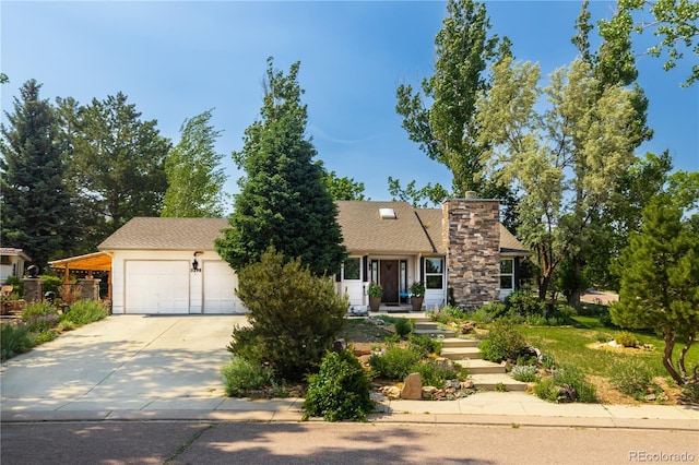 5298 Pony Creek Cir, Colorado Springs, CO 80919 - view of front of property featuring concrete driveway, a chimney, and a garage