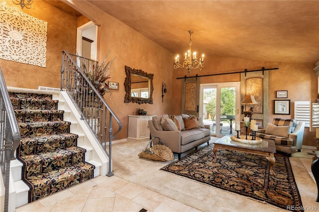 5298 Pony Creek Cir, Colorado Springs, CO 80919 - carpeted living room with a barn door, a chandelier, tile patterned flooring, stairway, and vaulted ceiling