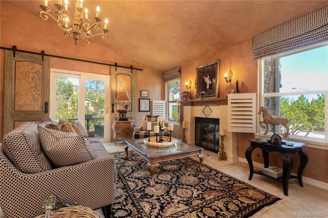 5298 Pony Creek Cir, Colorado Springs, CO 80919 - living area with a barn door, healthy amount of natural light, a fireplace, vaulted ceiling, and a chandelier