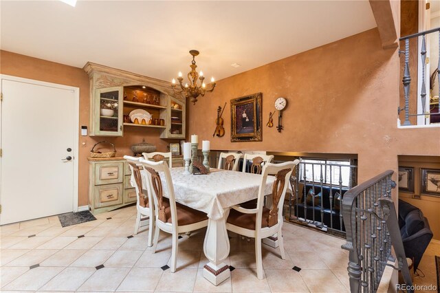 5298 Pony Creek Cir, Colorado Springs, CO 80919 - dining space with a chandelier and light tile patterned flooring