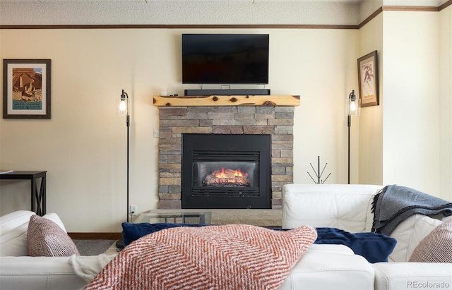 interior space featuring a stone fireplace, crown molding, and baseboards