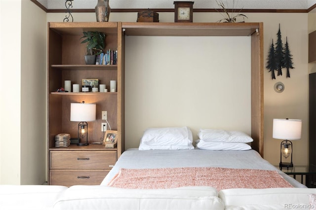 bedroom with crown molding