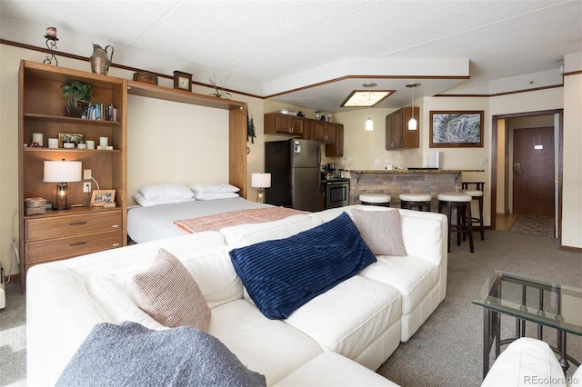 bedroom featuring freestanding refrigerator and light carpet