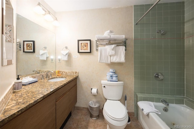 full bath with vanity, tile patterned floors, toilet, and shower / washtub combination