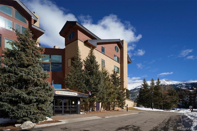 view of building exterior featuring a mountain view