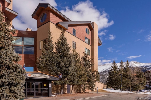 view of building exterior with a mountain view