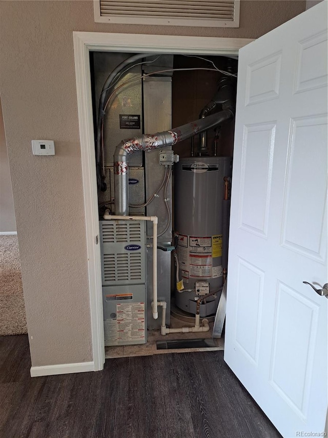 2226 W Elizabeth St Unit C304, Fort Collins, CO 80521 - utility room featuring gas water heater and heating unit