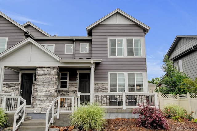 3765 W 88th Ct, Westminster, CO 80031 - rear view of property featuring stone siding and a porch
