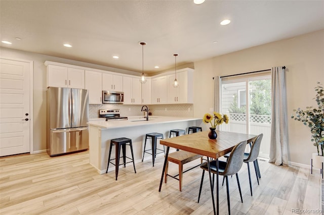 3765 W 88th Ct, Westminster, CO 80031 - dining room featuring light wood-style flooring, recessed lighting, and baseboards