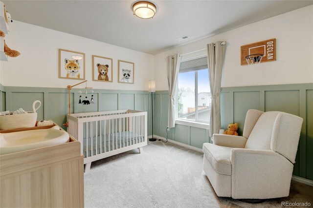 3765 W 88th Ct, Westminster, CO 80031 - bedroom with a decorative wall, a sink, carpet flooring, a crib, and a wainscoted wall