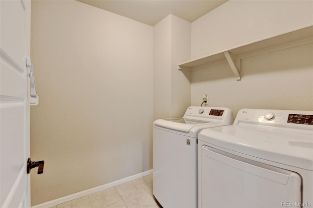 3765 W 88th Ct, Westminster, CO 80031 - laundry area with washing machine and clothes dryer, baseboards, and light tile patterned floors