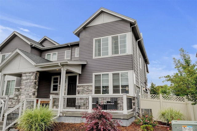 3765 W 88th Ct, Westminster, CO 80031 - rear view of property with a porch and stone siding