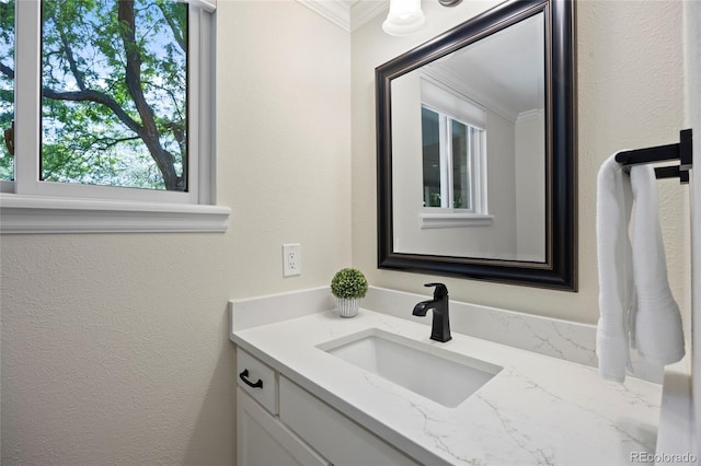 3726 E Nichols Ave, Centennial, CO 80122 - bathroom featuring crown molding, vanity, and a textured wall