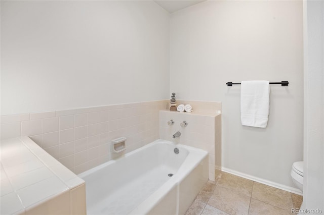 3726 E Nichols Ave, Centennial, CO 80122 - bathroom featuring a bath, toilet, baseboards, and tile patterned flooring