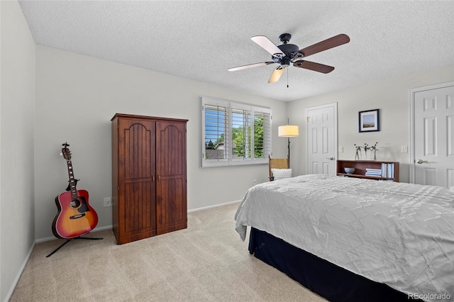 3726 E Nichols Ave, Centennial, CO 80122 - bedroom featuring light carpet, a textured ceiling, baseboards, and ceiling fan