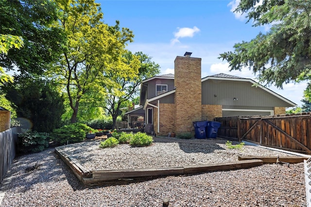 3726 E Nichols Ave, Centennial, CO 80122 - rear view of property with brick siding and a chimney