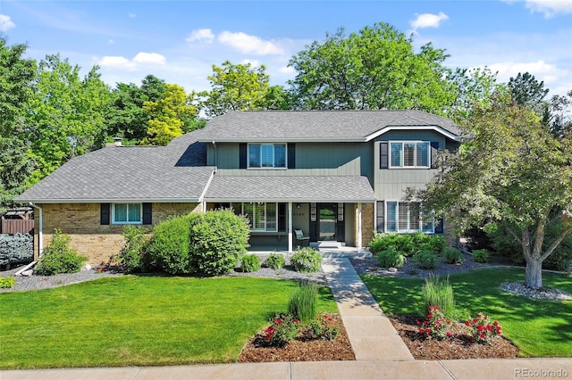 3726 E Nichols Ave, Centennial, CO 80122 - traditional-style house featuring a porch, brick siding, a front yard, and roof with shingles