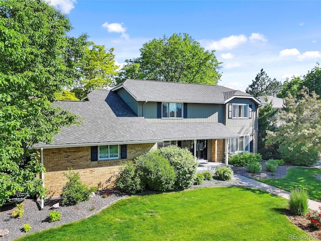 3726 E Nichols Ave, Centennial, CO 80122 - traditional home featuring brick siding, a front yard, and a shingled roof