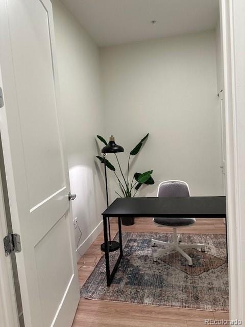 2876 W 53rd Ave Unit 305, Denver, CO 80221 - office area featuring wood finished floors and baseboards