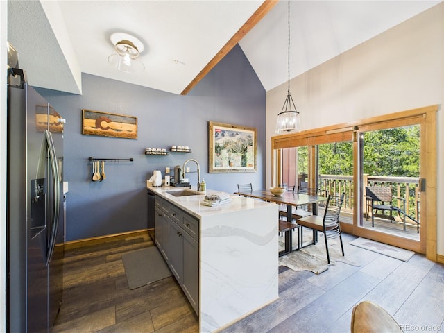 27 Lake Ridge Cir Unit 1842, Dillon, CO 80435 - kitchen with stainless steel fridge, a sink, a peninsula, dark wood-style floors, and high vaulted ceiling