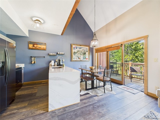 27 Lake Ridge Cir Unit 1842, Dillon, CO 80435 - dining area featuring dark wood-style flooring, baseboards, and high vaulted ceiling