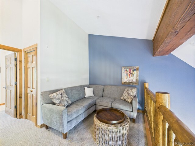 27 Lake Ridge Cir Unit 1842, Dillon, CO 80435 - living area with carpet, vaulted ceiling, and baseboards
