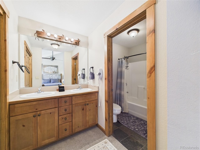 27 Lake Ridge Cir Unit 1842, Dillon, CO 80435 - full bathroom featuring double vanity, ceiling fan, toilet, shower / bathtub combination with curtain, and tile patterned floors