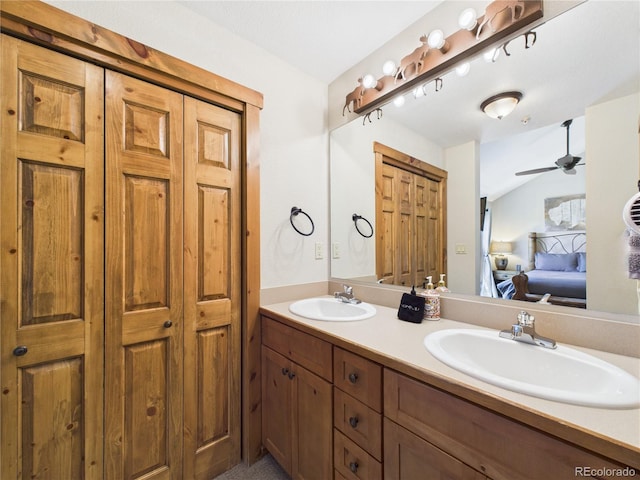 27 Lake Ridge Cir Unit 1842, Dillon, CO 80435 - full bathroom featuring double vanity, connected bathroom, ceiling fan, a closet, and lofted ceiling