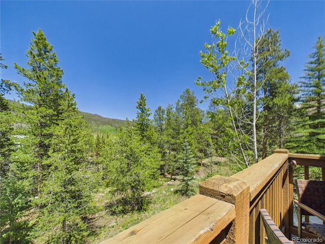 27 Lake Ridge Cir Unit 1842, Dillon, CO 80435 - wooden terrace featuring a view of trees