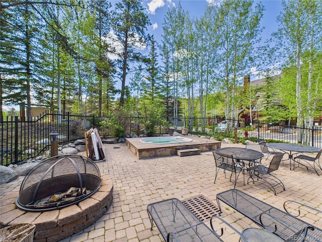 27 Lake Ridge Cir Unit 1842, Dillon, CO 80435 - view of patio featuring a fire pit and an in-ground hot tub