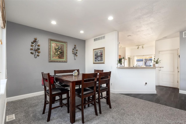 dining space featuring baseboards, visible vents, and recessed lighting