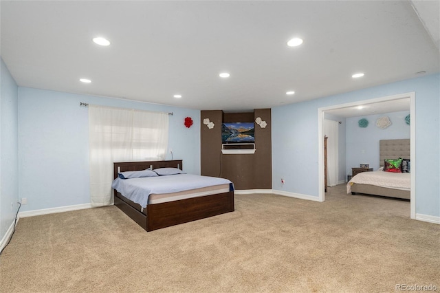 carpeted bedroom featuring baseboards and recessed lighting