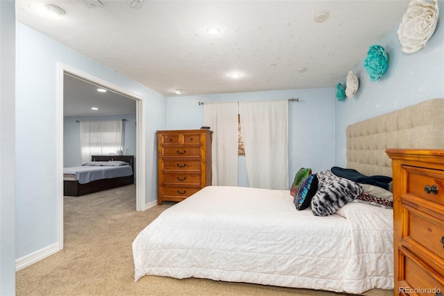 bedroom featuring carpet floors and baseboards