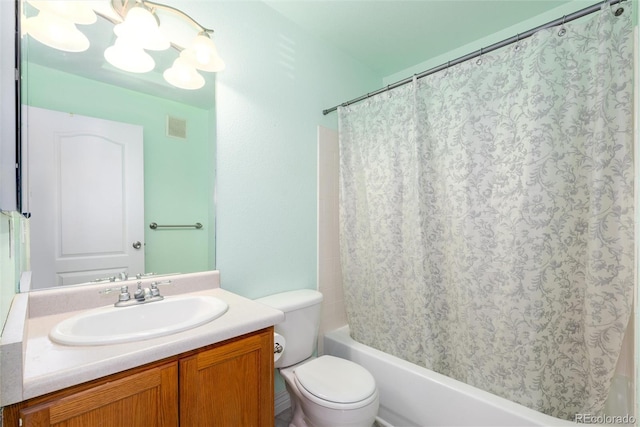 bathroom featuring visible vents, shower / tub combo with curtain, vanity, and toilet