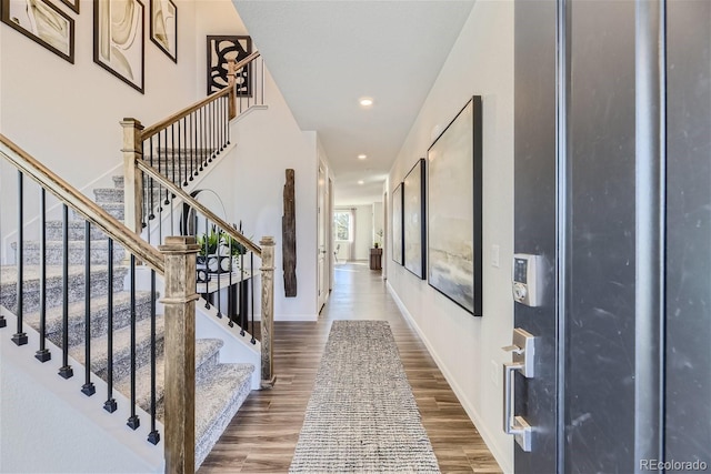 entryway featuring recessed lighting, baseboards, and wood finished floors