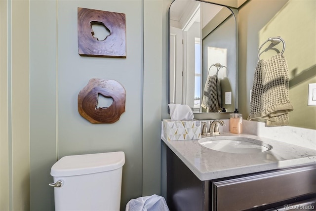 half bath with vanity and toilet