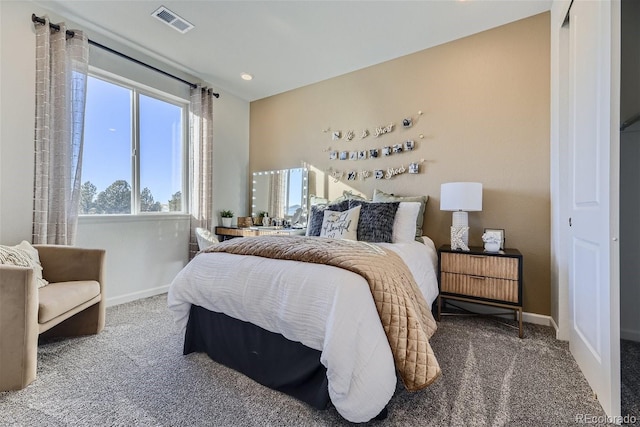 bedroom featuring visible vents, baseboards, and carpet flooring