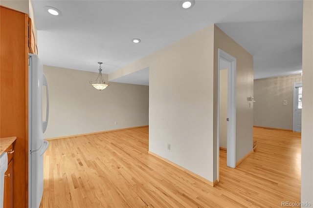 9930 W Progress Pl, Littleton, CO 80123 - empty room featuring light wood-type flooring, recessed lighting, and baseboards