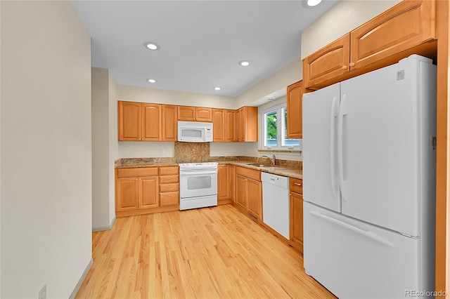 9930 W Progress Pl, Littleton, CO 80123 - kitchen with white appliances, a sink, light wood-style flooring, recessed lighting, and light countertops