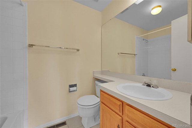 9930 W Progress Pl, Littleton, CO 80123 - bathroom featuring vanity, toilet, tile patterned floors, baseboards, and shower / bathtub combination