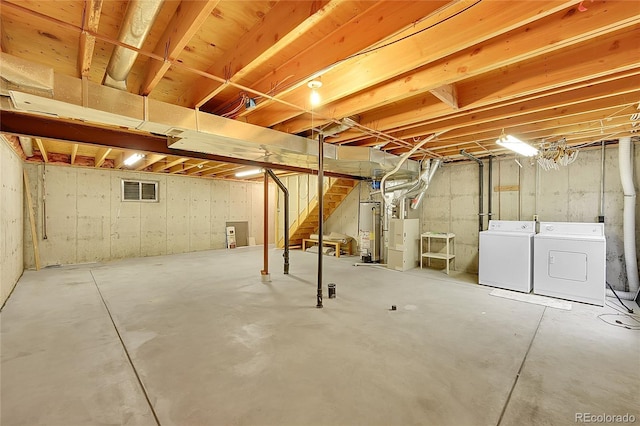 9930 W Progress Pl, Littleton, CO 80123 - unfinished below grade area with washer and clothes dryer, stairs, and gas water heater