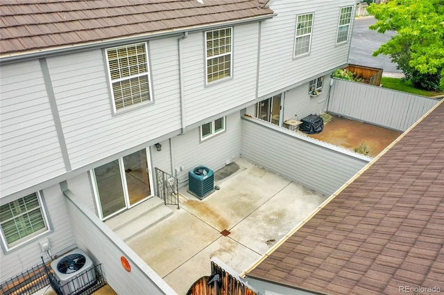 9930 W Progress Pl, Littleton, CO 80123 - rear view of house with central air condition unit and a patio area