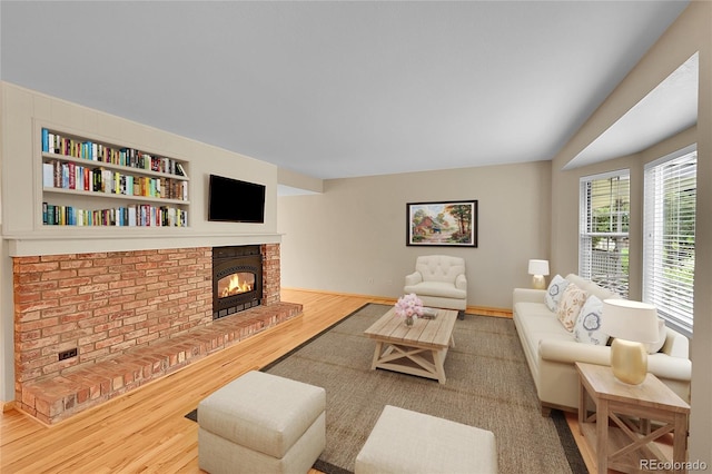 9930 W Progress Pl, Littleton, CO 80123 - living area featuring wood finished floors and a fireplace